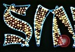 Image of Times Square neon lights in rain New York City USA, 1954, second 49 stock footage video 65675021110