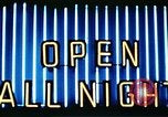 Image of Times Square neon lights in rain New York City USA, 1954, second 53 stock footage video 65675021110