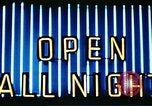 Image of Times Square neon lights in rain New York City USA, 1954, second 54 stock footage video 65675021110