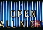Image of Times Square neon lights in rain New York City USA, 1954, second 55 stock footage video 65675021110