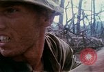 Image of Soldiers help injured South Vietnam, 1967, second 40 stock footage video 65675021190