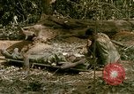 Image of wounded rescued by Huey helicopter South Vietnam, 1967, second 38 stock footage video 65675021192