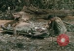 Image of wounded rescued by Huey helicopter South Vietnam, 1967, second 40 stock footage video 65675021192