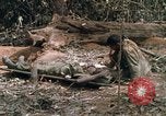 Image of wounded rescued by Huey helicopter South Vietnam, 1967, second 46 stock footage video 65675021192