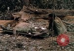 Image of wounded rescued by Huey helicopter South Vietnam, 1967, second 48 stock footage video 65675021192