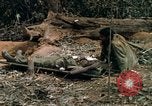 Image of wounded rescued by Huey helicopter South Vietnam, 1967, second 50 stock footage video 65675021192