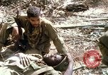 Image of wounded rescued by Huey helicopter South Vietnam, 1967, second 51 stock footage video 65675021192