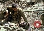 Image of wounded rescued by Huey helicopter South Vietnam, 1967, second 52 stock footage video 65675021192