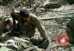 Image of wounded rescued by Huey helicopter South Vietnam, 1967, second 53 stock footage video 65675021192