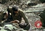Image of wounded rescued by Huey helicopter South Vietnam, 1967, second 54 stock footage video 65675021192