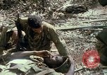 Image of wounded rescued by Huey helicopter South Vietnam, 1967, second 55 stock footage video 65675021192