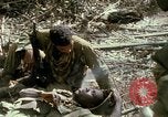 Image of wounded rescued by Huey helicopter South Vietnam, 1967, second 57 stock footage video 65675021192