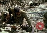 Image of wounded rescued by Huey helicopter South Vietnam, 1967, second 58 stock footage video 65675021192