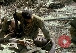 Image of wounded rescued by Huey helicopter South Vietnam, 1967, second 59 stock footage video 65675021192