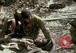 Image of wounded rescued by Huey helicopter South Vietnam, 1967, second 60 stock footage video 65675021192