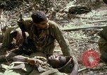 Image of wounded rescued by Huey helicopter South Vietnam, 1967, second 62 stock footage video 65675021192