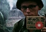 Image of U.S. Army 196th Lt Inf Brigade knock down damaged building wall Vietnam, 1968, second 4 stock footage video 65675021200