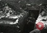 Image of US Army soldiers prepare for gas attack in World War 1 trench France, 1918, second 15 stock footage video 65675021500