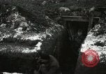 Image of US Army soldiers prepare for gas attack in World War 1 trench France, 1918, second 16 stock footage video 65675021500