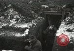Image of US Army soldiers prepare for gas attack in World War 1 trench France, 1918, second 20 stock footage video 65675021500