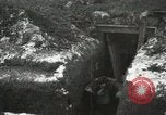 Image of US Army soldiers prepare for gas attack in World War 1 trench France, 1918, second 22 stock footage video 65675021500