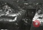 Image of US Army soldiers prepare for gas attack in World War 1 trench France, 1918, second 23 stock footage video 65675021500