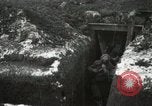 Image of US Army soldiers prepare for gas attack in World War 1 trench France, 1918, second 30 stock footage video 65675021500
