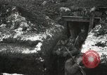 Image of US Army soldiers prepare for gas attack in World War 1 trench France, 1918, second 34 stock footage video 65675021500