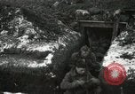 Image of US Army soldiers prepare for gas attack in World War 1 trench France, 1918, second 35 stock footage video 65675021500