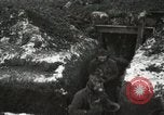 Image of US Army soldiers prepare for gas attack in World War 1 trench France, 1918, second 36 stock footage video 65675021500