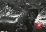 Image of US Army soldiers prepare for gas attack in World War 1 trench France, 1918, second 37 stock footage video 65675021500