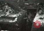 Image of US Army soldiers prepare for gas attack in World War 1 trench France, 1918, second 38 stock footage video 65675021500