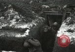 Image of US Army soldiers prepare for gas attack in World War 1 trench France, 1918, second 39 stock footage video 65675021500