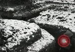 Image of US Army soldiers prepare for gas attack in World War 1 trench France, 1918, second 49 stock footage video 65675021500