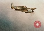 Image of wrecked planes and fire on USS Yorktown World War 2 Pacific Theater, 1944, second 4 stock footage video 65675021565