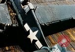 Image of wrecked planes and fire on USS Yorktown World War 2 Pacific Theater, 1944, second 16 stock footage video 65675021565