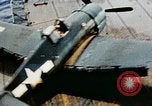 Image of wrecked planes and fire on USS Yorktown World War 2 Pacific Theater, 1944, second 17 stock footage video 65675021565