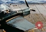 Image of wrecked planes and fire on USS Yorktown World War 2 Pacific Theater, 1944, second 18 stock footage video 65675021565