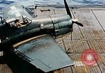 Image of wrecked planes and fire on USS Yorktown World War 2 Pacific Theater, 1944, second 19 stock footage video 65675021565