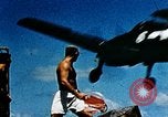 Image of wrecked planes and fire on USS Yorktown World War 2 Pacific Theater, 1944, second 24 stock footage video 65675021565