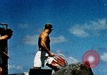 Image of wrecked planes and fire on USS Yorktown World War 2 Pacific Theater, 1944, second 25 stock footage video 65675021565