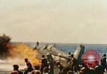 Image of wrecked planes and fire on USS Yorktown World War 2 Pacific Theater, 1944, second 33 stock footage video 65675021565