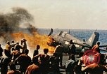 Image of wrecked planes and fire on USS Yorktown World War 2 Pacific Theater, 1944, second 37 stock footage video 65675021565