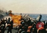 Image of wrecked planes and fire on USS Yorktown World War 2 Pacific Theater, 1944, second 39 stock footage video 65675021565