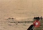 Image of burial at sea aboard USS Yorktown in World War  Pacific Theater, 1944, second 24 stock footage video 65675021567