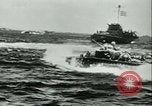 Image of World War II amphibious assault in Pacific Pacific Theater, 1944, second 5 stock footage video 65675021727