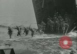Image of World War II amphibious assault in Pacific Pacific Theater, 1944, second 14 stock footage video 65675021727