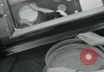 Standbild PrecisionGrinding von Glaslinsen Anaheim California USA, 1960, aus Sekunde 15 historischem Filmmaterial Videoclip 65675022147