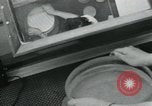 Standbild PrecisionGrinding von Glaslinsen Anaheim California USA, 1960, aus Sekunde 17 historischem Filmmaterial Videoclip 65675022147