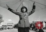 Image of Traffic policeman under umbrella Baghdad Iraq, 1942, second 8 stock footage video 65675022192